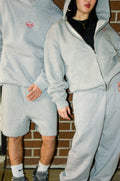 Danny(left) is 5'5 wearing medium and Shay(right) is 5'1 wearing small.