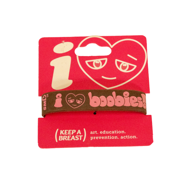 Red wristband with heart design and text on a white background